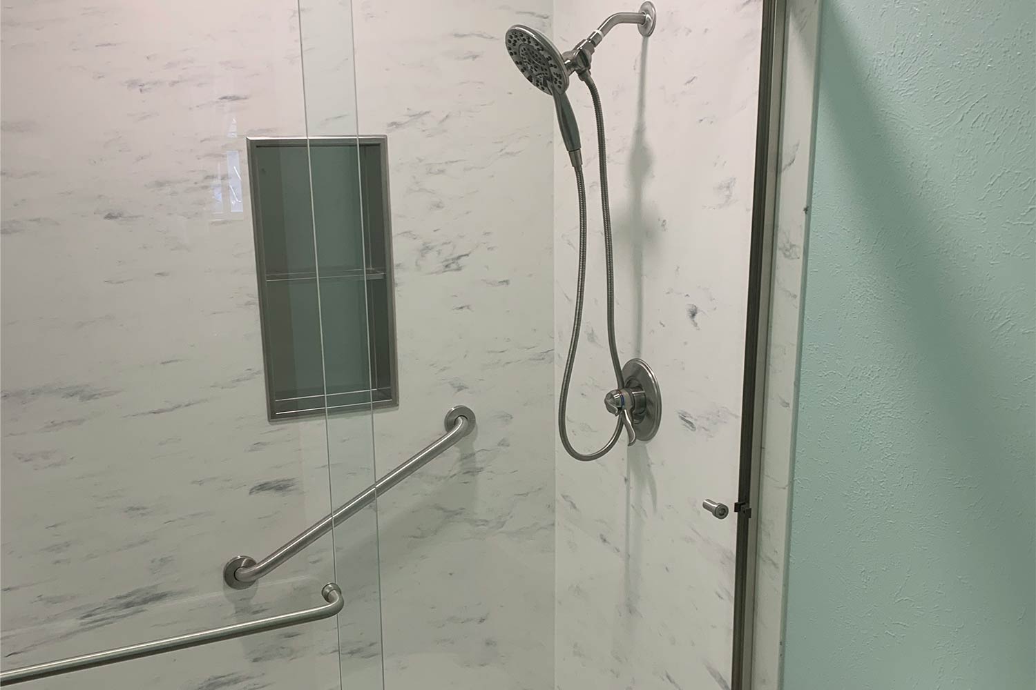 Safety handle installed in a shower.